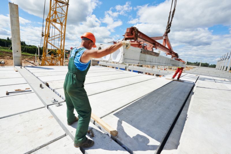 Two concreters installing a concrete slab in Townsville