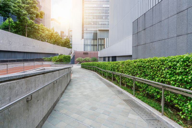 concrete path next to a commercial building