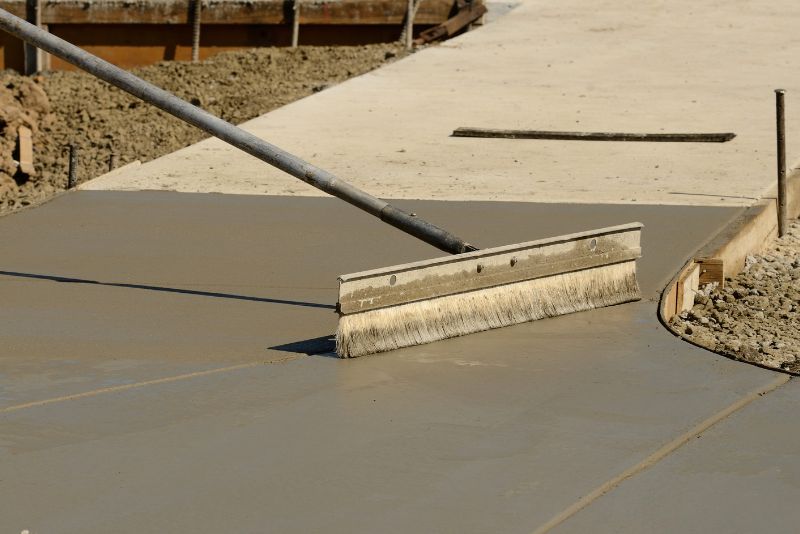 Concreter working on a finished concrete surface
