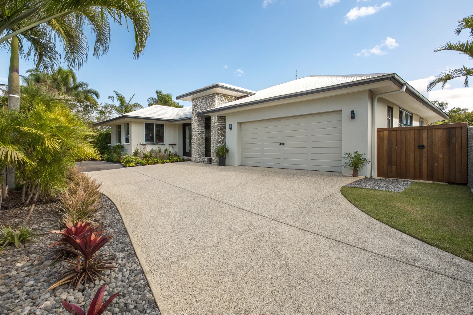 Modern Australian home with a wide exposed aggregate concrete outdoor area